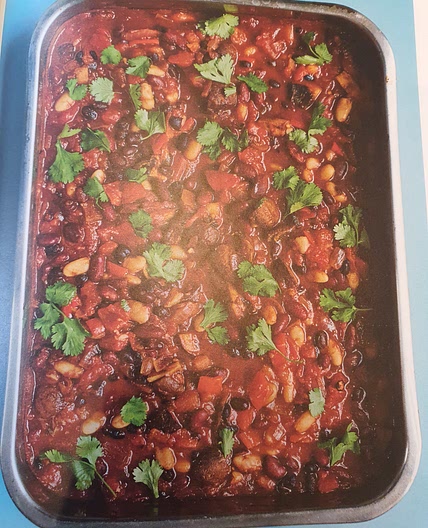 Three bean chilli with avocado salsa