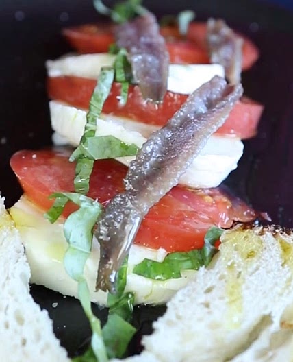 Healthy fresh caprese and anchovies lunch 