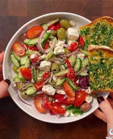 GREEK SALAD WITH OLIVE OIL GARLIC BREAD.