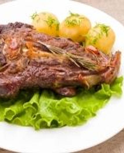 Lamb recipe with cumin couscous and fruits with honey