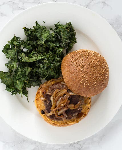 Beef Burgers with Paprika Mayo, Caramelized Onions & Kale Crisps