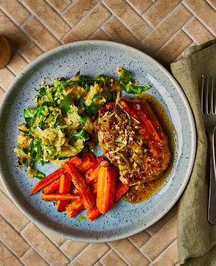 Pork steak with bubble and squeak mash and sweet leek gravy