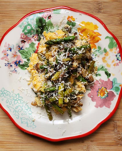 Scrambled eggs with asparagus, mushrooms, and ricotta.