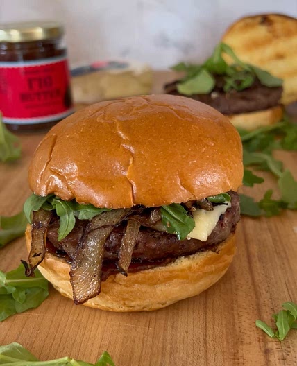 Fig Butter Burger with Brie, Caramelized Onions, and Arugala