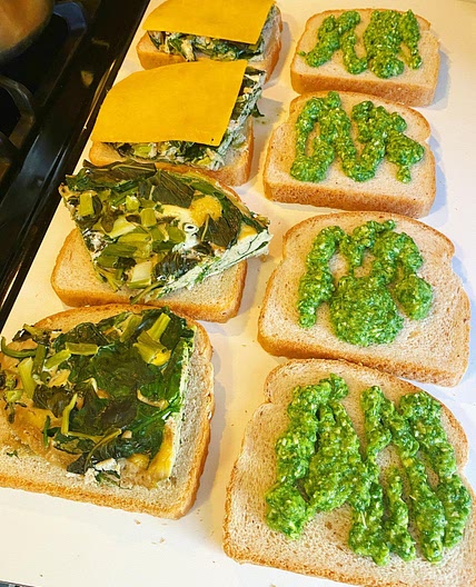 Steamed egg sandwich with spinach, cheddar and aji verde sauce