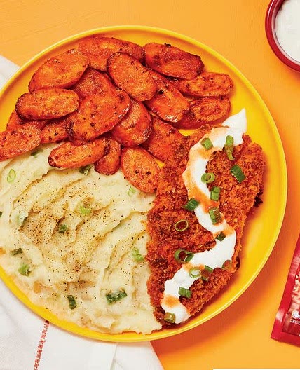 Crispy Frank’s RedHot®-Spiced Chicken with Blue Cheese Sauce, Scallion Mashed Potatoes & Carrots