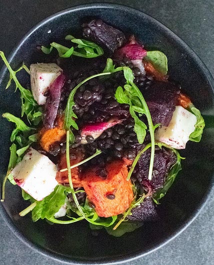 Puy lentils with roasted carrots and beetroot, walnuts and goats cheese
