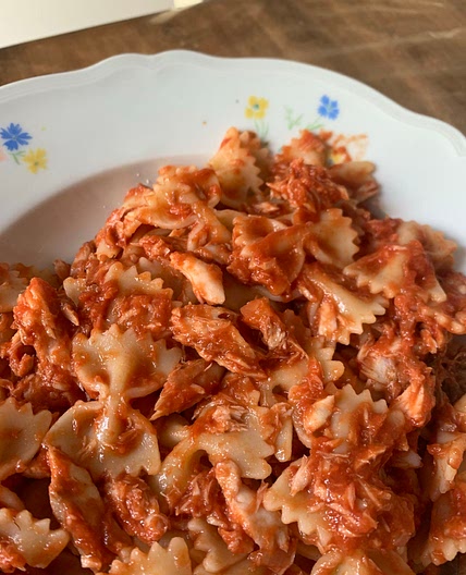 Farfalle pasta with tomato sauce and mackerel fish (sgombro)