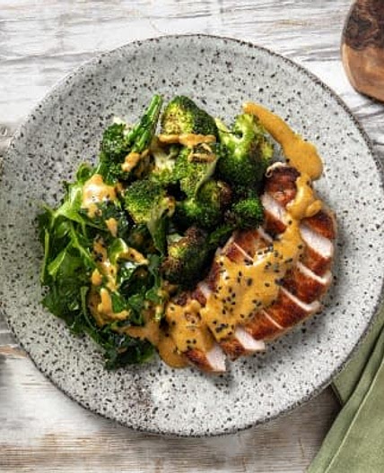 Satay Inspired Pork Loin Steak
with Garlic Broccoli and Sesame Seeds