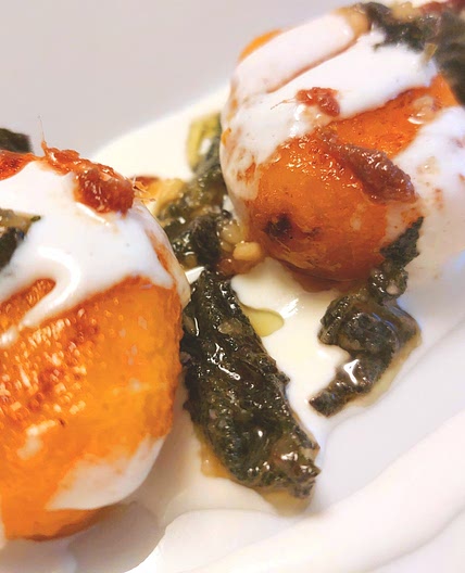 Pumpkin gnocchi with burrata, sage pesto and anchovies.
