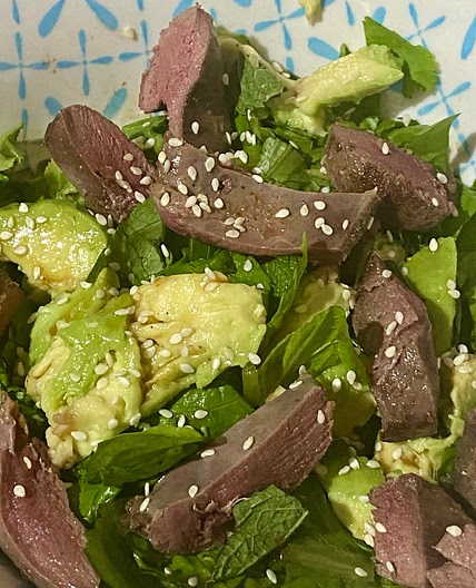 Five Spice Pigeon Breast on a Asian Herb Salad tossed in a Hoisin Dressing