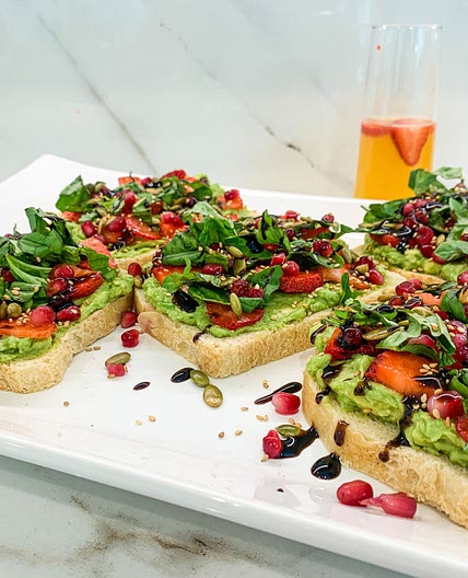 AVOCADO TOAST WITH STRAWBERRIES AND POMEGRANATES