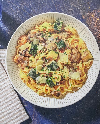 Mediterranean inspired pasta with vegetables and creamy ricotta sauce and chives
