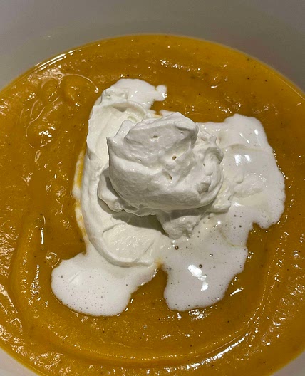 Sweet potato soup with rum cream