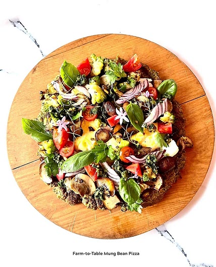 Mung Bean Pizza Toppings of Sauteed Spinach, Oyster Mushroom, Heirloom Tomato,  Kale Sesame Seeds Walnut Pesto