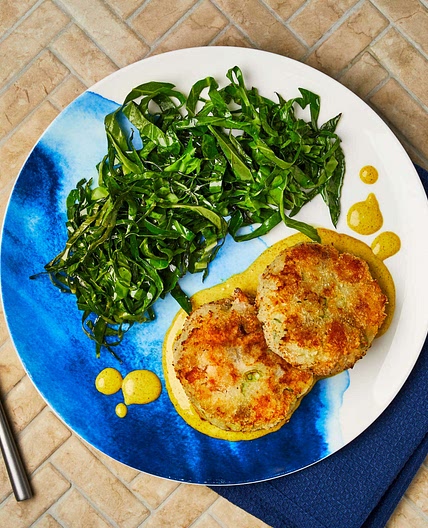 Smoky fish cakes with wilted greens and curried mayo