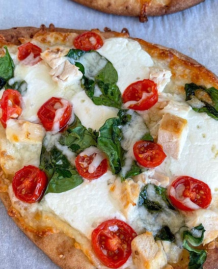 If you’re looking for a quick and easy dinner idea these naan pizzas are the way to go. They are delicious and super simple to make, I got the garlic naan and everything else from Aldi. You can definitely leave it just veggies and cheese or you can add chi