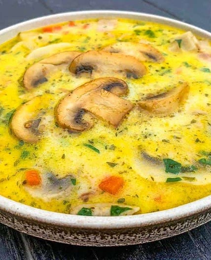 Creamy mushroom soup with fresh herbs