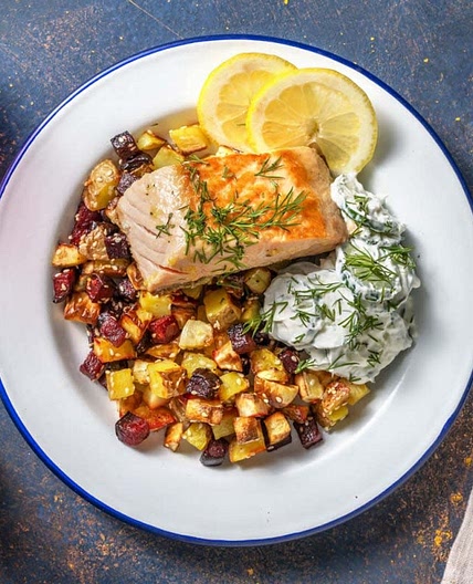 Fried salmon with oven baked root veg and creamy cucumber salad
