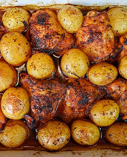 Marinated Chicken Thighs And Potatoes Baked In The Oven