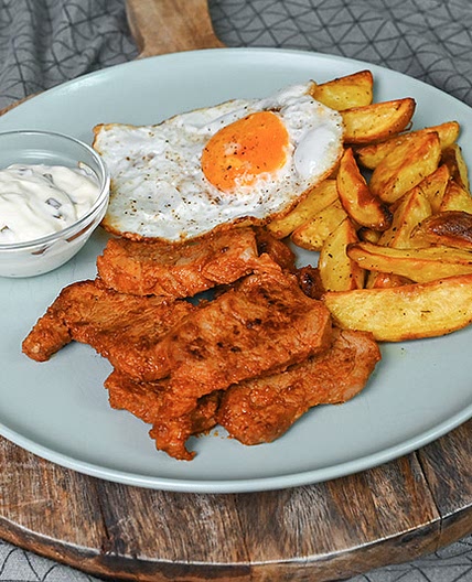 Pork Tenderloin Medallions Served With Crispy Potato Wedges