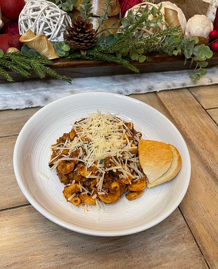 Beef Cavatappi Bolognese with sautéed Zucchini & Parmesan