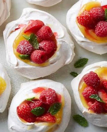 Pavlova shells, berries and custard 