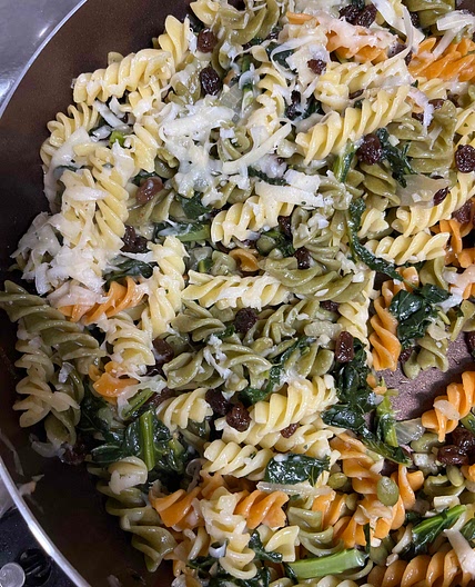 Pasta with winter greens, onions and raisins