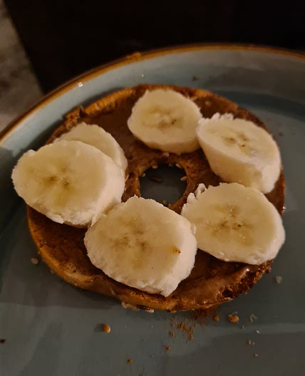 Almond butter and banana on a bagel