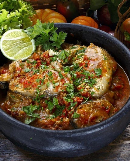 Tender fish in a spicy tomato sauce with coconut milk