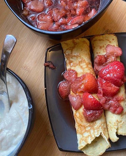 Coconut flour crepes with maple ricotta and strawberry syrup