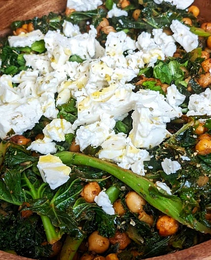 Warm chickpea and kale salad with cumin seeds and lime