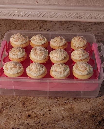 Coconut cupcakes with coconut whipped cream icing