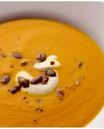 Pumpkin, saffron & orange soup with caramelised pumpkin seeds