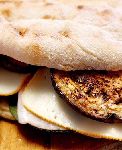 Panini - grilled eggplants, ham and edam cheese sandwich