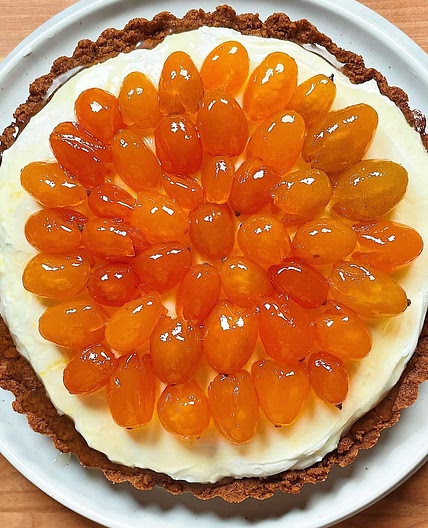 NO-BAKE CHEESECAKE with candied kumquats and brown butter cookie crust