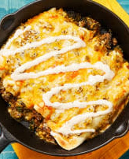 One-Pan Beef Enchiladas Verdes with Mexican Cheese Blend & Hot Sauce Crema