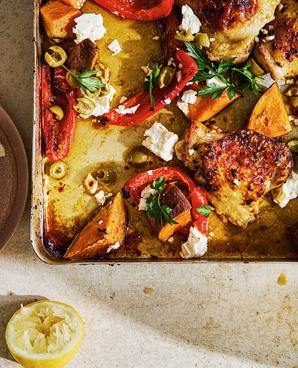 Roast chicken thighs with red peppers, sweet potatoes, green olives and feta recipe