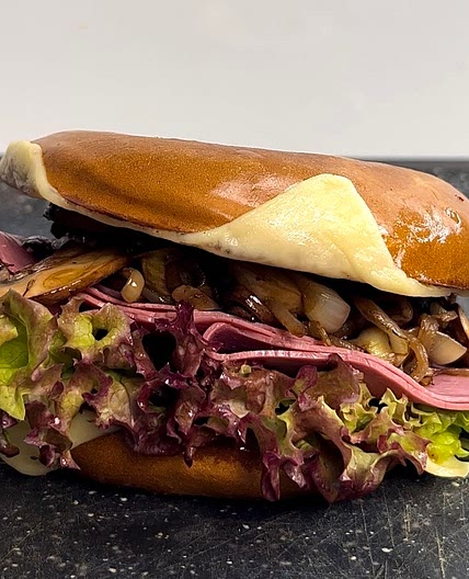 Cheesy ham and mushroom bagel