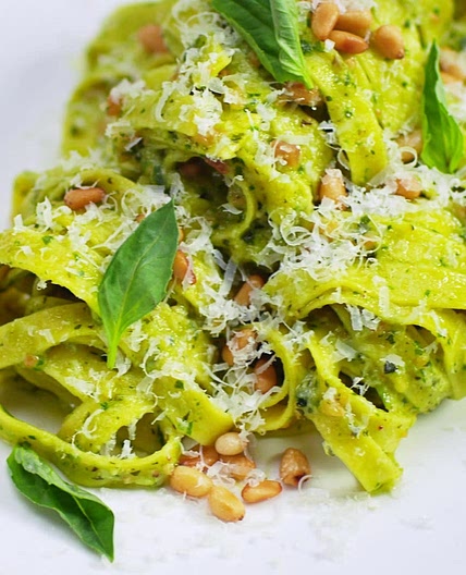 HOMEMADE PASTA WITH PESTO IN A PARMESAN WHEEL