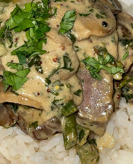 Steak in a Creamy Mushroom and Asparagus Sauce