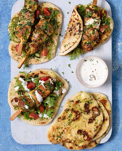 Spiced chicken skewers with garlic herb flatbreads