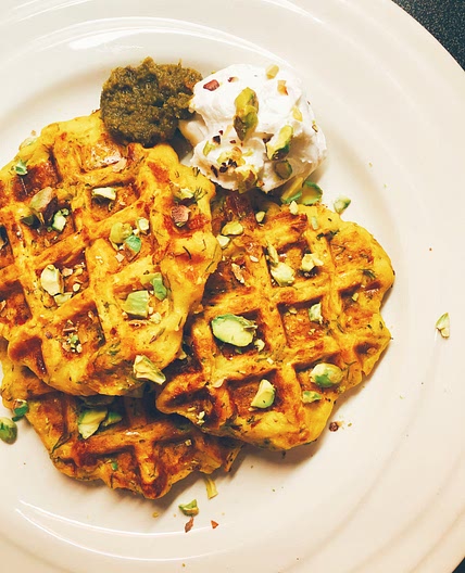 Zucchini waffles with pesto sauce & pistachios