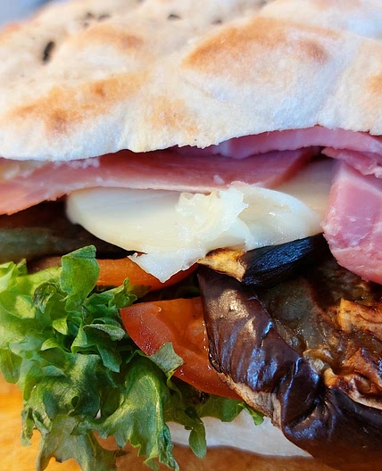 Panini - grilled eggplants, ham and scamorza chees sandwich