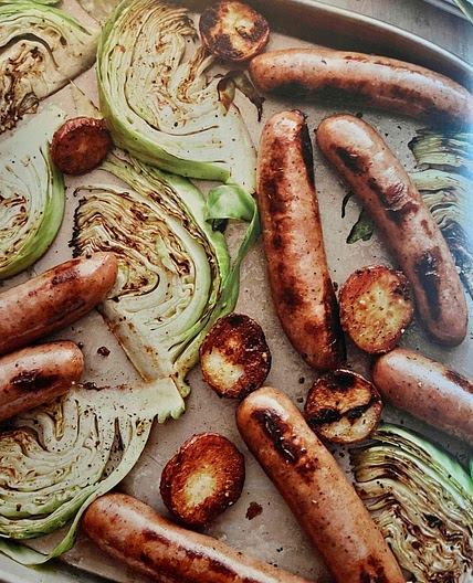 Roasted sausages with potatoes and cabbage