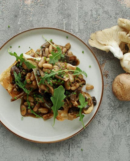 Mixed mushrooms and creamy white beans on toast