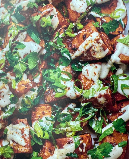 Harissa sweet potatoes with roasted garlic & tahini dressing