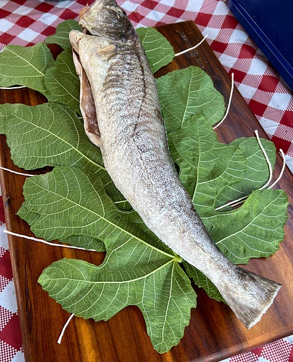 Best way to cook the whole fish. Cod cooked in fig leaves, old greek recipe with the twist.