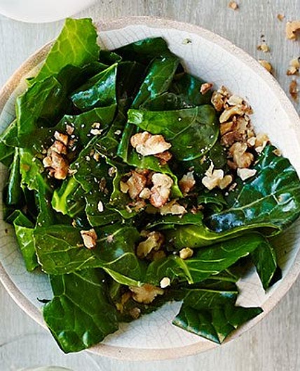 Wilted spring greens in nut oil