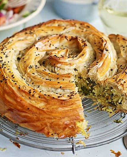 Veggie spiral pie with spiced tomato sauce & chopped salad